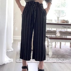 Black capris with white pinstripes, paper bag waist with belt